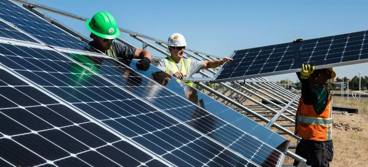 India's solar sector at an inflection point as risks of oversupply, trade disruptions looming — विस्तार से समझिए 3 Module manufacturing lines and workers in an Indian factory,