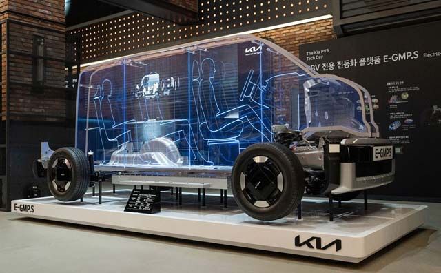 Kia PV5 pilot interior showing configurable seating and modular cargo layout.